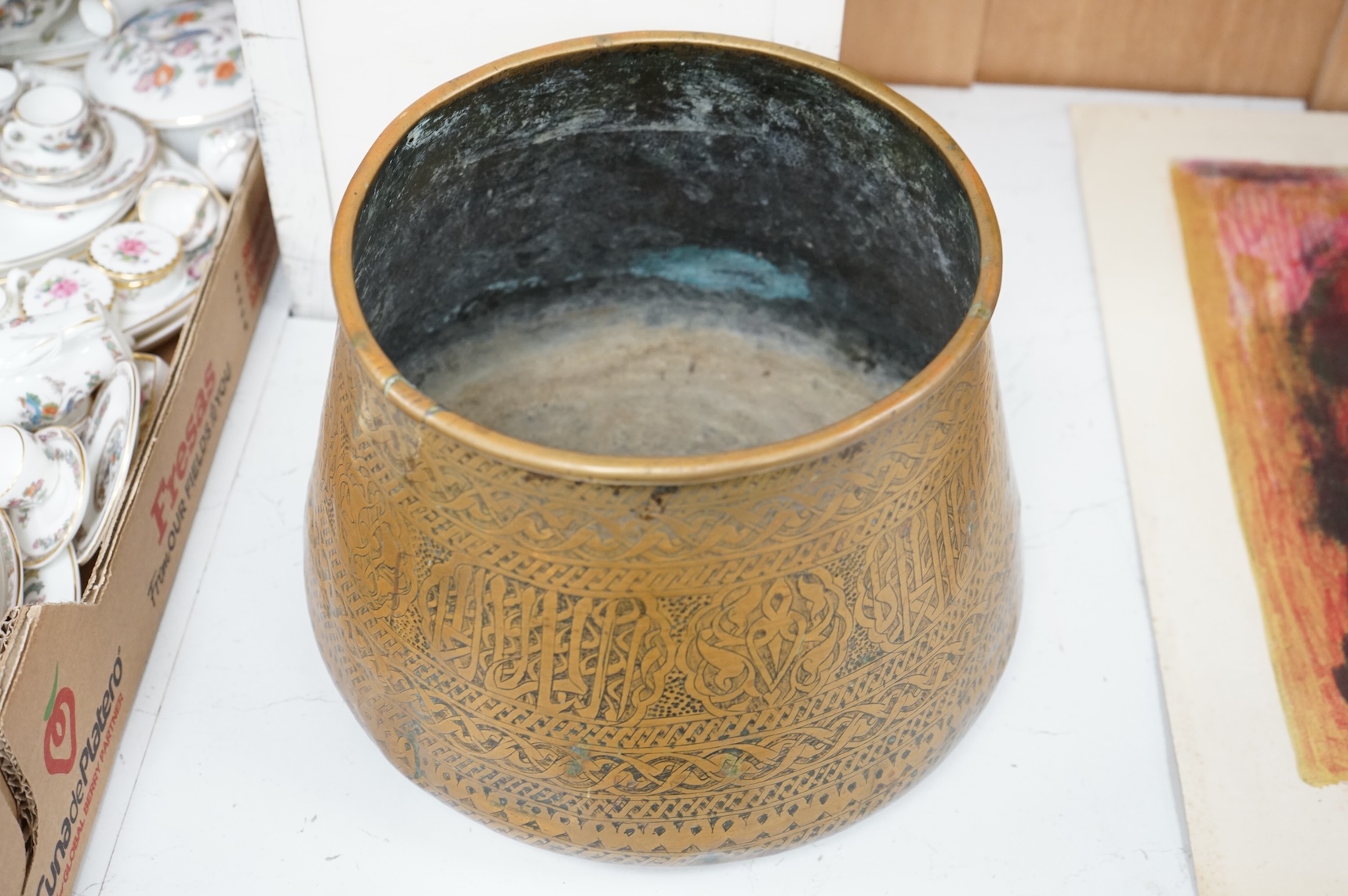 A Syrian Islamic copper vessel with detailed surface engraved pattern, 19cm high